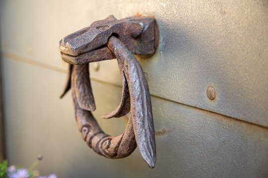 Old door knocker, ancient metal ring handle. Realistic set of rusty doorknobs.
