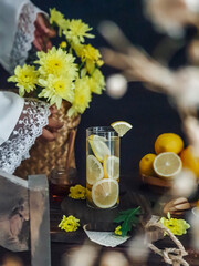 summer drinks. Mojito, lemonade with flowers on wooden table background