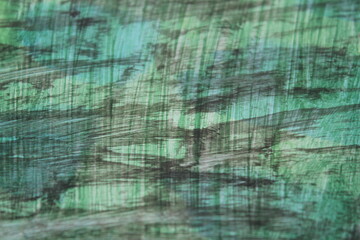 Greenish paint pattern background, black texture backdrop surface