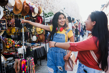 portrait of young latin woman travellers in tourist market in Mexico Latin America, hispanic...