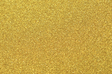 Gold texture background in bright light. Shiny luxury gold color texture background.