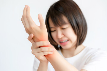Woman with wrist sprain and wrist pain due to inflammation. Health care concept.