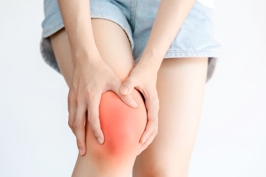 Close up Woman having knee pain. Concept of health problems.