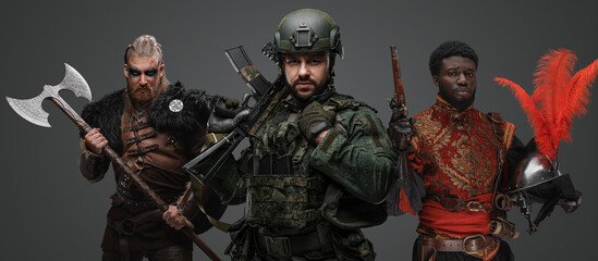Studio shot of special forces soldier with nordic warrior and black conquistador.