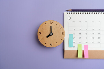close up of calendar on the purple table background, planning for business meeting or travel planning concept
