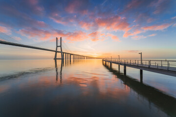 Fototapeta na wymiar Vasco da Gama bridge at sunrise in Lisbon, Portugal