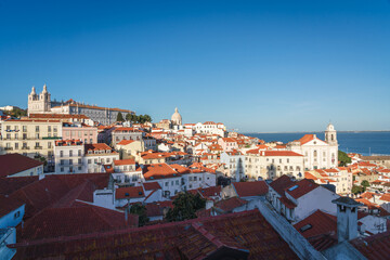 City skyline of the old Alfama district in Lisbon at dusk