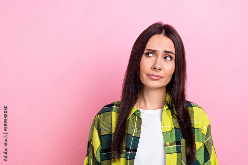 Poster portrait of cute girlish funny woman with long hairdo wear plaid shirt look at billboard empty space