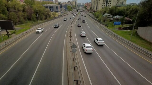 Almaty city, Al-Farabi avenue before rain, highway traffic in time lapse
