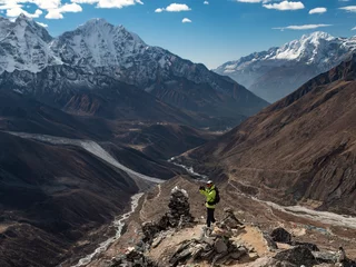 Fotobehang Ama Dablam Male trekker taking a selfie after ascending a peak on the Everest Base camp trek.