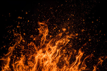 Fototapeta na wymiar Fiery sparks on black: Details of blazing flames isolated on a dark background. created with Generative AI