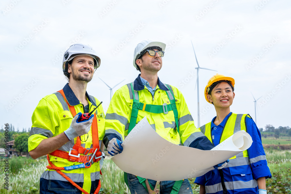 Aufkleber group of engineers planning discuss project ann working in wind turbine farm,sustainable future.