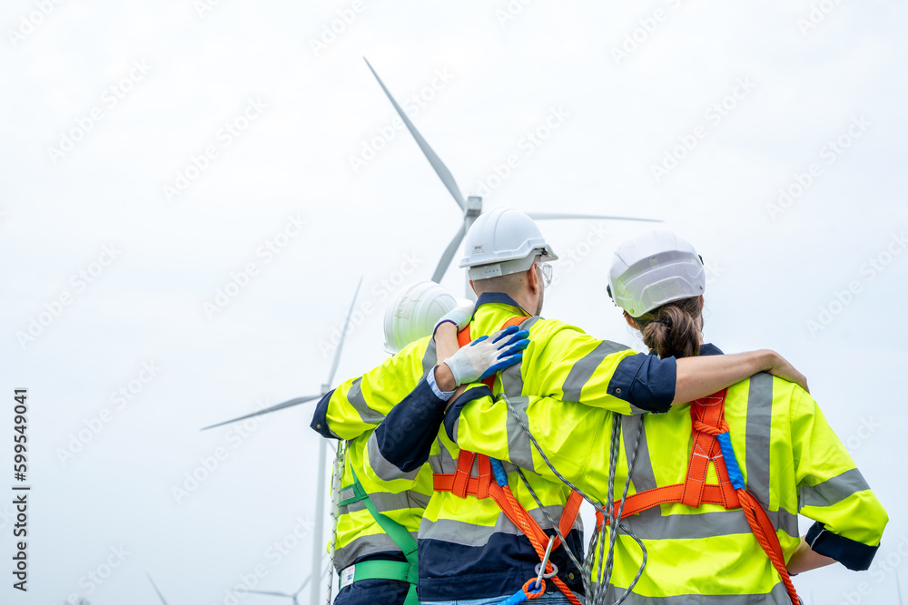 Poster electrical engineer checking on wind turbine energy production,concept of alternative energy and ser