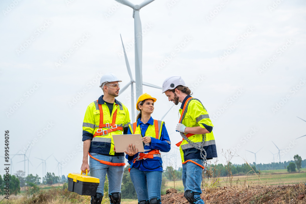 Poster group of engineers are working with a blueprint in wind turbine farm,wind power station,renewable an
