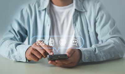 Businessman using Smart Phone with Customer support hotline Contact us people connection. the email, call phone, address, Chat message icons..