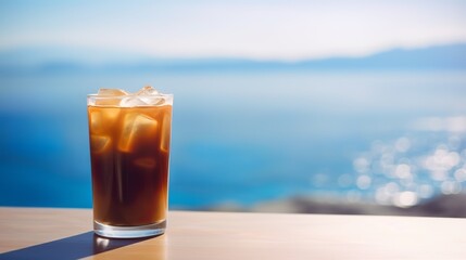 Iced cold coffee at the beach bar with blurred tropical seascape in the background, Generative AI