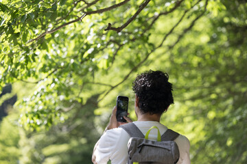 People who take pictures with their smartphones when climbing or trekking.