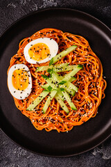 Korean traditional food, cucumber and boiled egg cold spicy noodles.