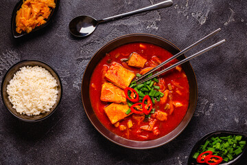 Korean traditional food, spicy kimchi soup (kimchi tige) with pork and tofu cheese.