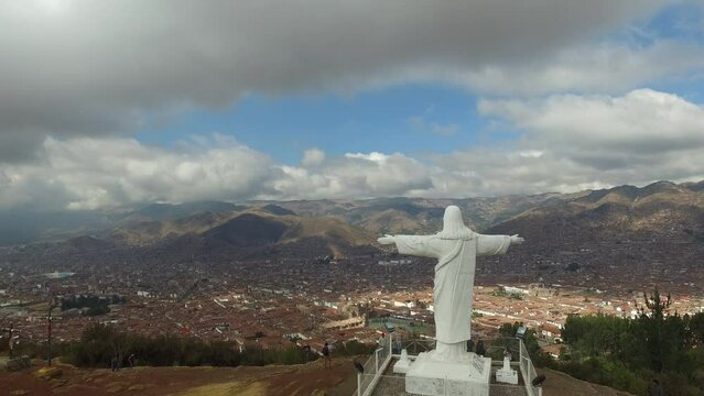 Aerial Shot of Cristo Blanco de Cuzco in Peru, South America. Christ Redeemer Statue on top of a mountain