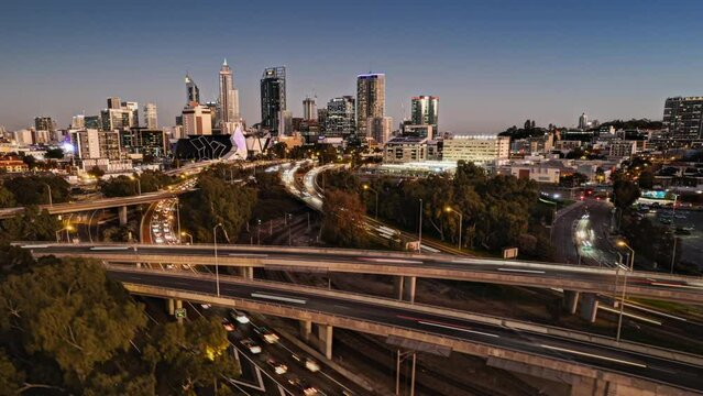 Drone time lapse hyper lapse of Perth and freeway at twilight