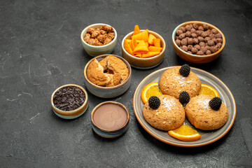 front view delicious cookies with orange slices on dark-grey background cookie biscuit sweet cake tea