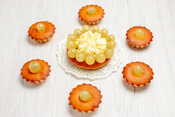 front view delicious little cakes perfect sweets for tea lined on white desk cake pie sweet dessert tea