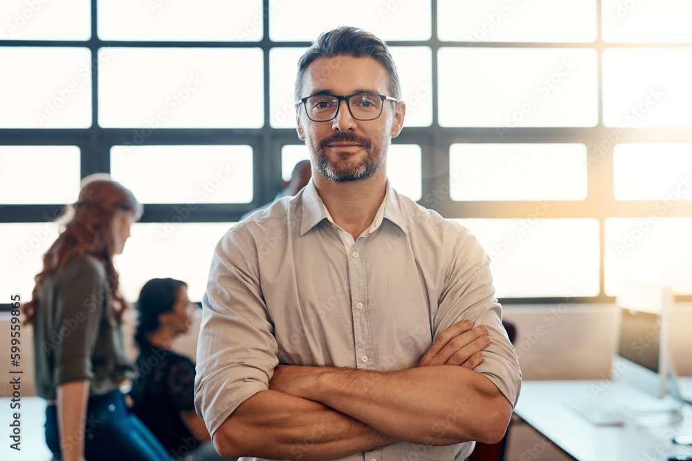 Poster he knows how to get a team to get results. portrait of a confident mature businessman standing in a 