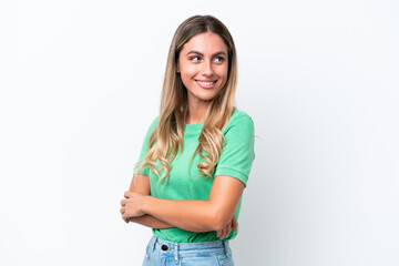 Young Uruguayan woman isolated on white background with arms crossed and happy