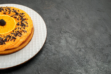 front view delicious pie with chocolate chips and orange slices on a dark background tea pie dessert cake fruit biscuit