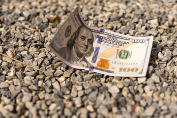 One hundred dollar banknote on the ground. Lost money concept