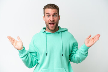 Fototapeta premium Young handsome caucasian man isolated on white background with shocked facial expression