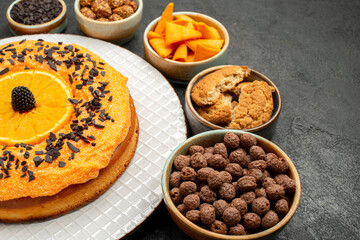 front view delicious pie with orange slices on a dark background tea biscuit fruit dessert pie cake