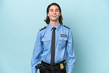 Young police caucasian man isolated on blue background with surprise facial expression
