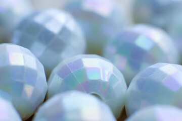 Handicraft pieces for costume jewelry, iridescent, mother-of-pearl color. Macro photography,...