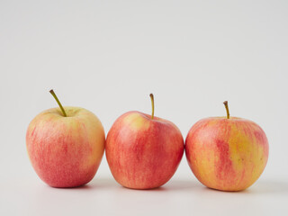 A red apple isolated on a white background with a cropped outline and full depth of field