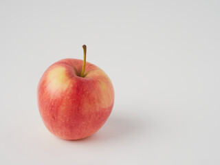 A red apple isolated on a white background with a cropped outline and full depth of field