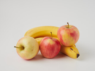 Banana and apple isolated on white background as package design element