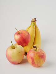 Banana and apple isolated on white background as package design element
