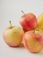 Banana and apple isolated on white background as package design element