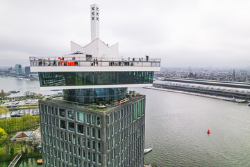 Amsterdam viewpoint on a cloudy day, modern building and the city view, drone shot. High quality...