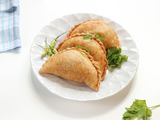 fried pastels atau pastel goreng are a kind of pastry made by placing the stuffing on top of the dough, then folded and tightly closed. Pastels can taste sweet or savory