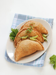 fried pastels atau pastel goreng are a kind of pastry made by placing the stuffing on top of the dough, then folded and tightly closed. Pastels can taste sweet or savory