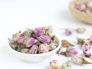 Dried french rosebuds isolated on white background