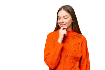 Young blonde woman over isolated chroma key background looking to the side and smiling