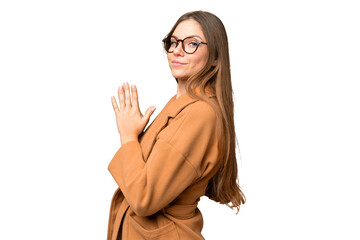 Young blonde woman over isolated chroma key background scheming something