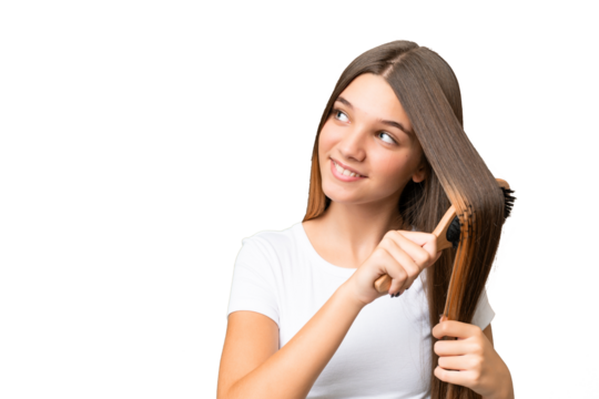 Teenager caucasian girl with hair comb over isolated background
