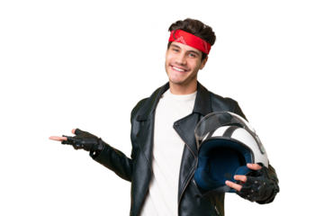 Young caucasian man with a motorcycle helmet over isolated background extending hands to the side for inviting to come