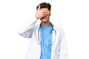 Young doctor man over isolated background covering eyes by hands. Do not want to see something