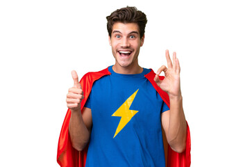 Super Hero caucasian man over isolated background showing ok sign and thumb up gesture